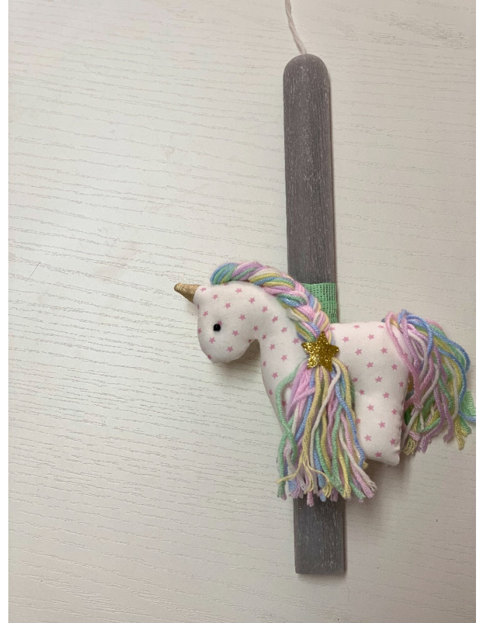 Handmade easter candle with handmade unicorn